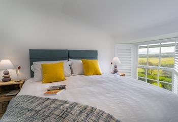 The bedroom boasts a luxury bed, that can be king size or twin, and stunning Cornish views. 