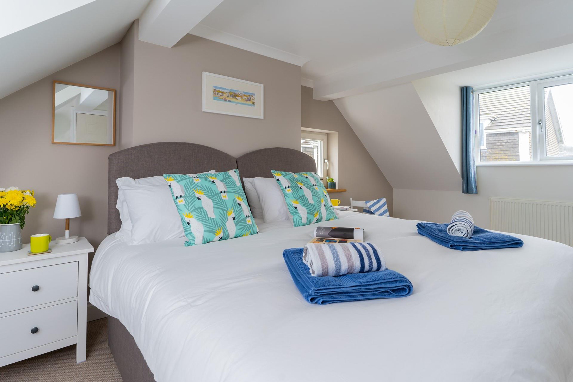 We love the quirky parrot cushions in bedroom 3!