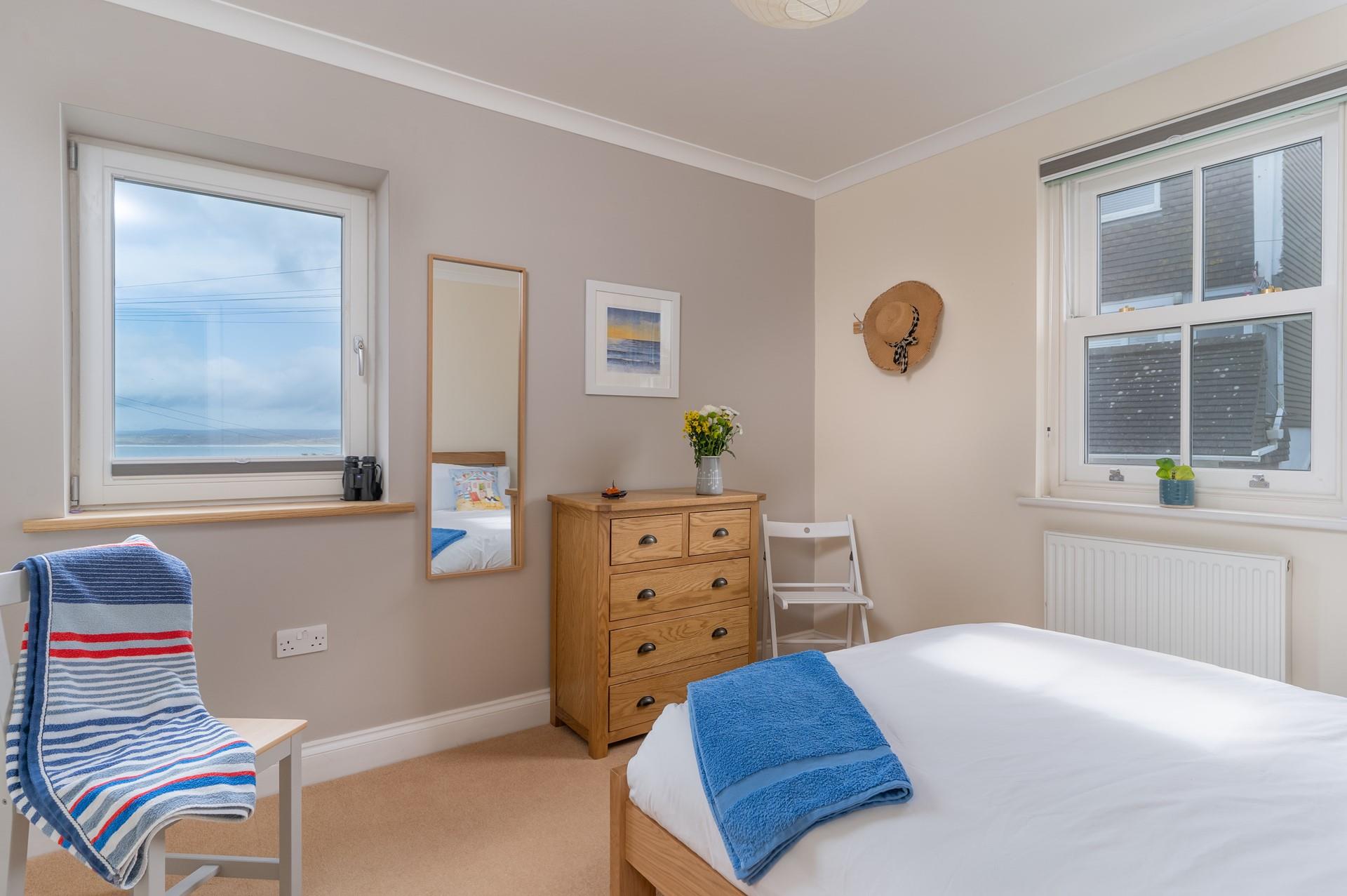 Wake up to sea views every morning in bedroom 1.