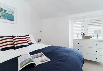 With classic seaside colours and stripes, bedroom 3 is a nautical retreat.