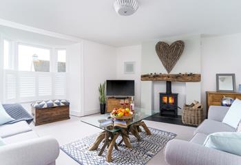 Cool coastal tones and stylish wooden features give the cosy lounge a nautical feel.