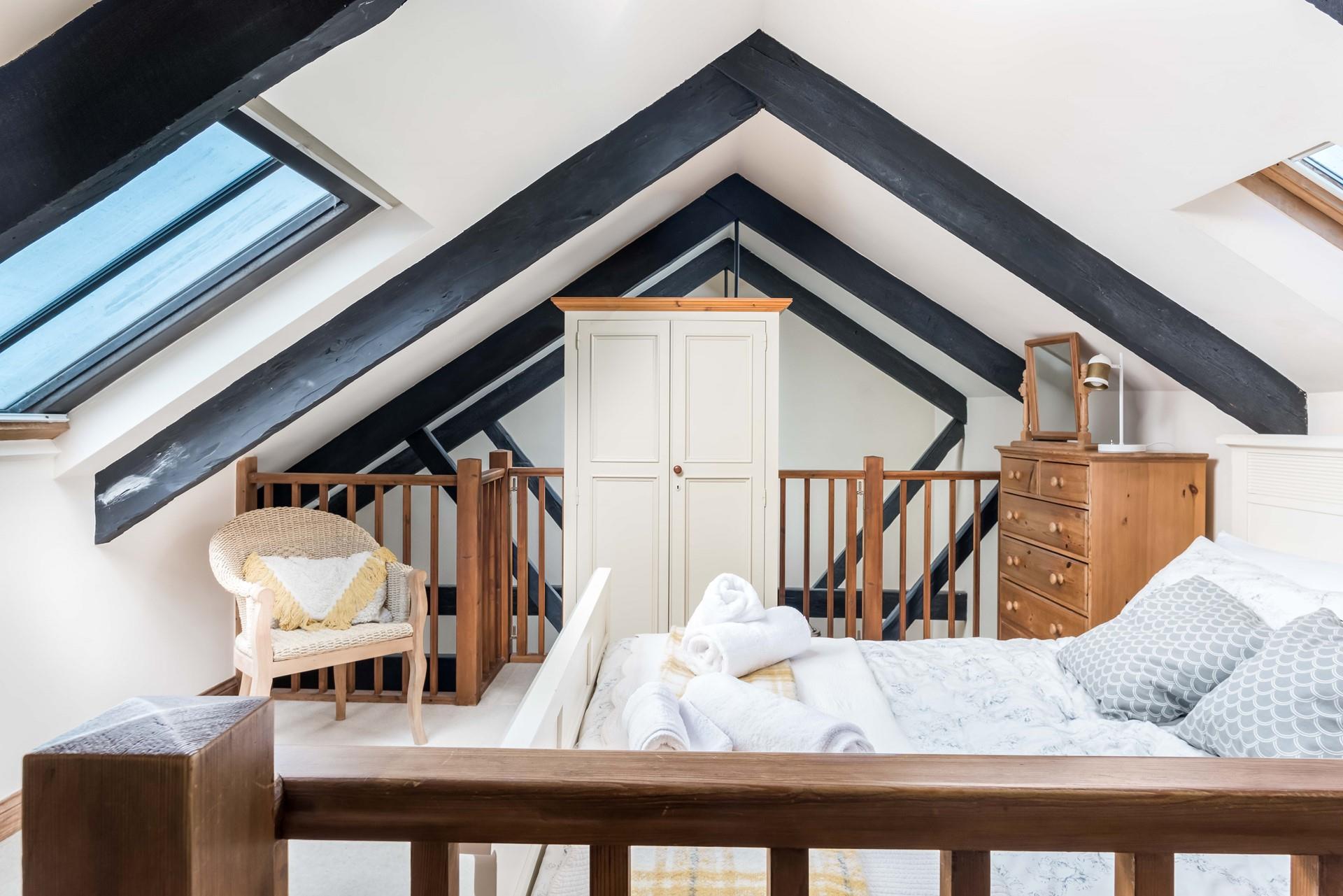 Fluffy towels await in the bedroom.