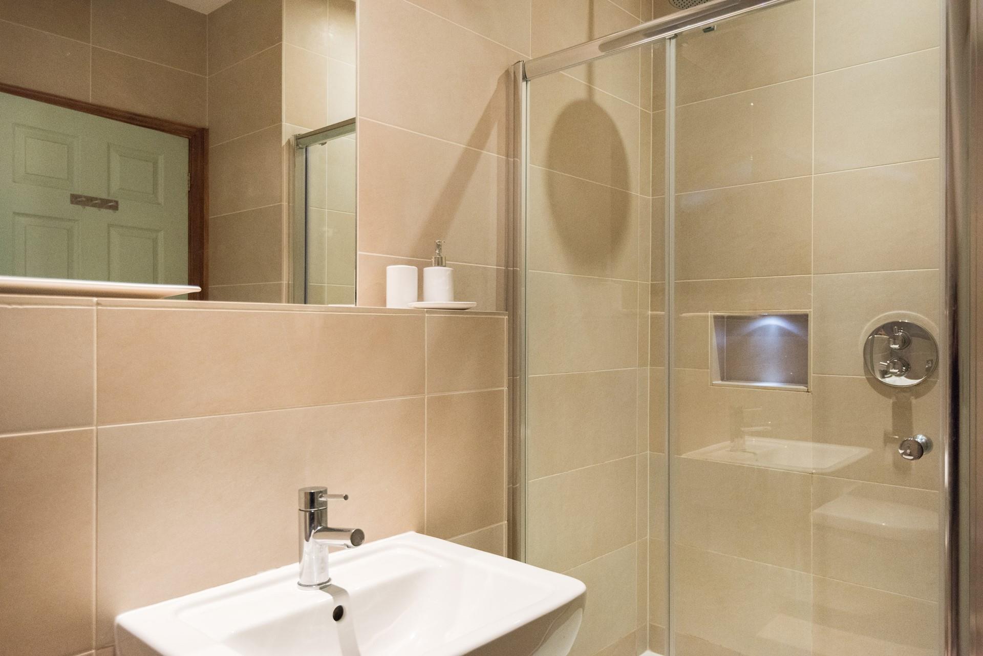 Wash off sandy toes in the shower after a day on the beach.