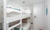 Bedroom 2 has painted wood bunk beds perfect for the little ones. - Thumbnail Image