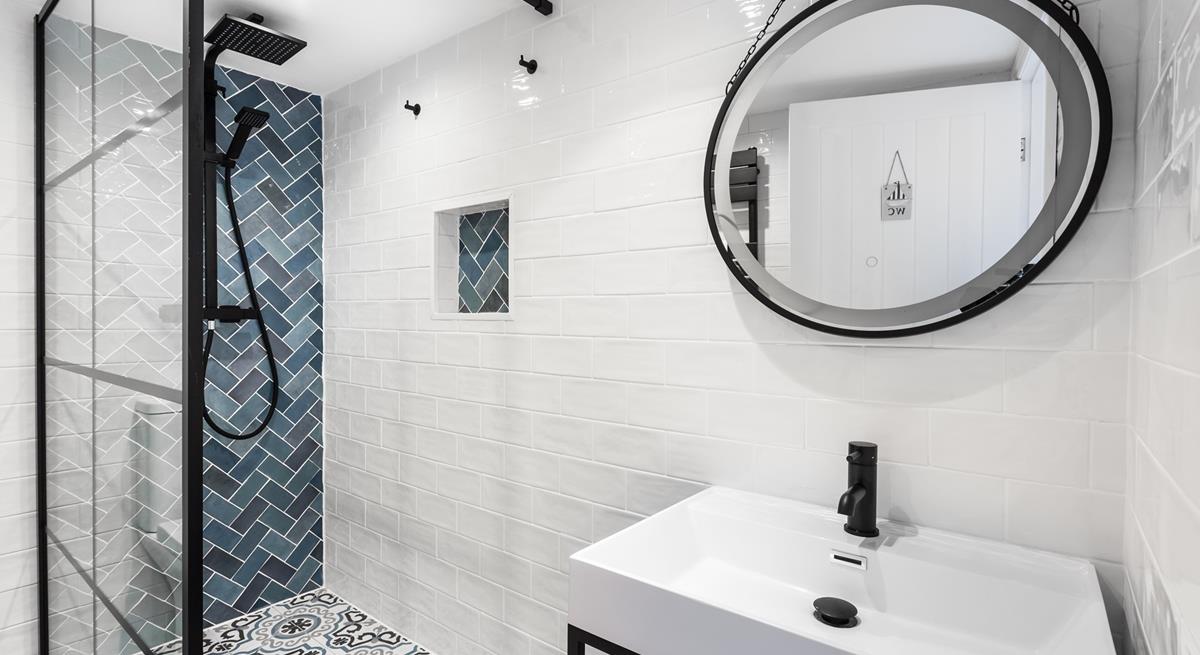 Wash off your sandy toes in the modern and light family shower room.