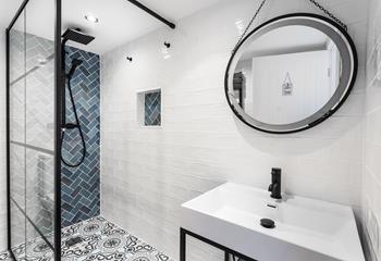 Wash off your sandy toes in the modern and light family shower room.
