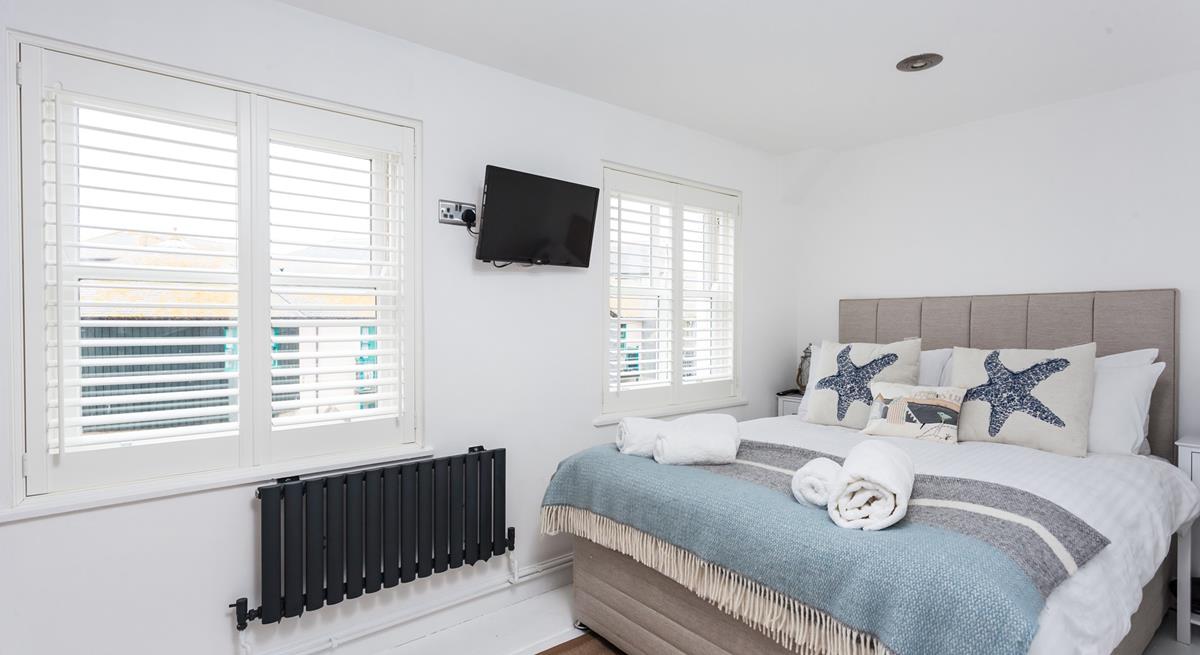 Bedroom 1 has a double textile divan bed and is decorated with a lovely blue seaside theme.