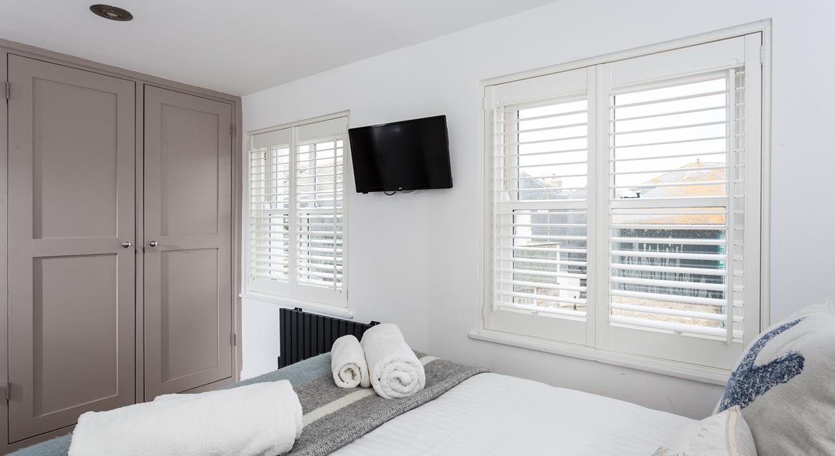 Bedroom 1 has painted wood built-in wardrobes with plenty of space for all your holiday clothes.