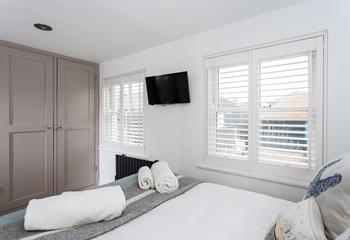 Bedroom 1 has painted wood built-in wardrobes with plenty of space for all your holiday clothes.