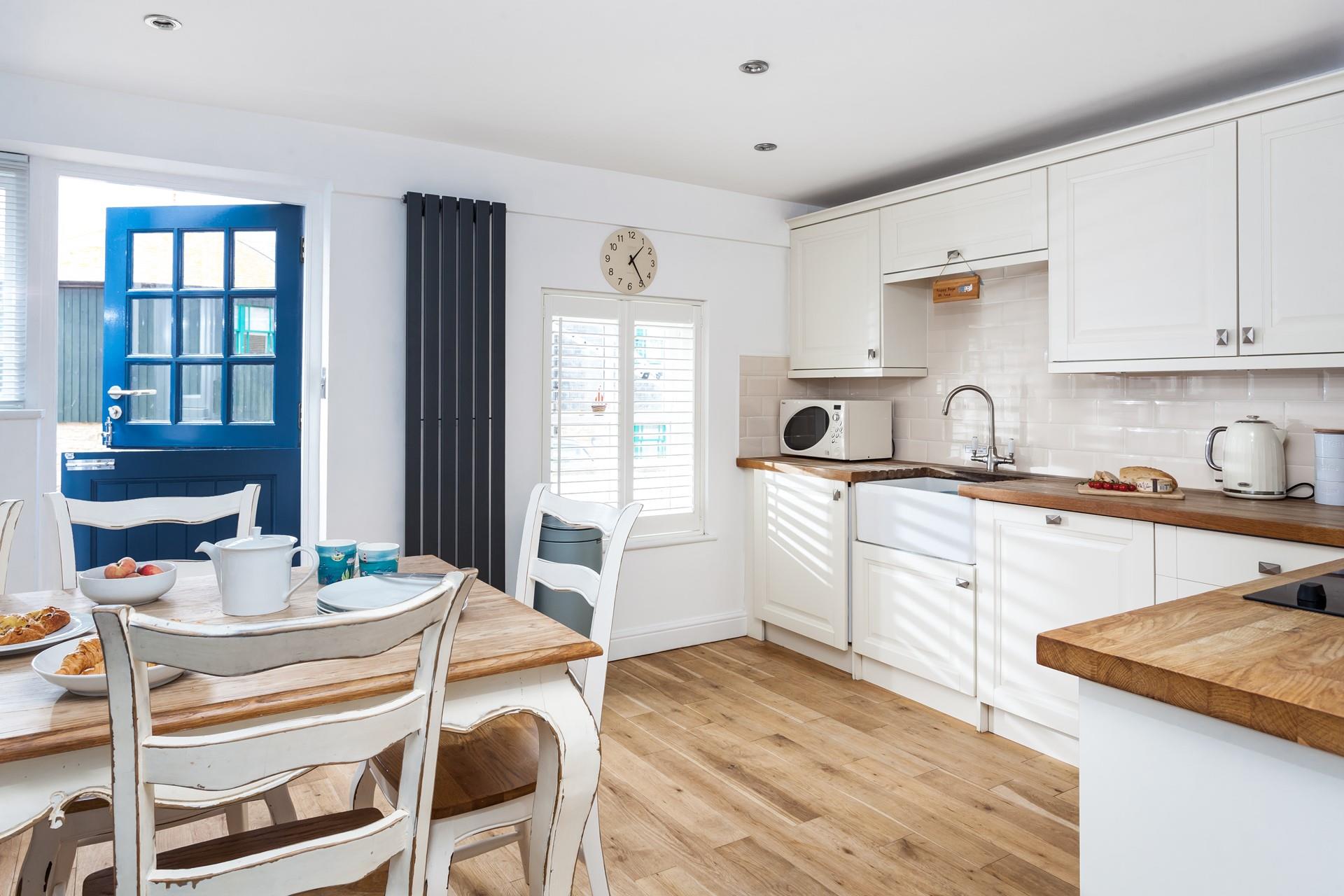 Enjoy breakfast on the farmhouse-style dining table and chairs before heading out for the day.