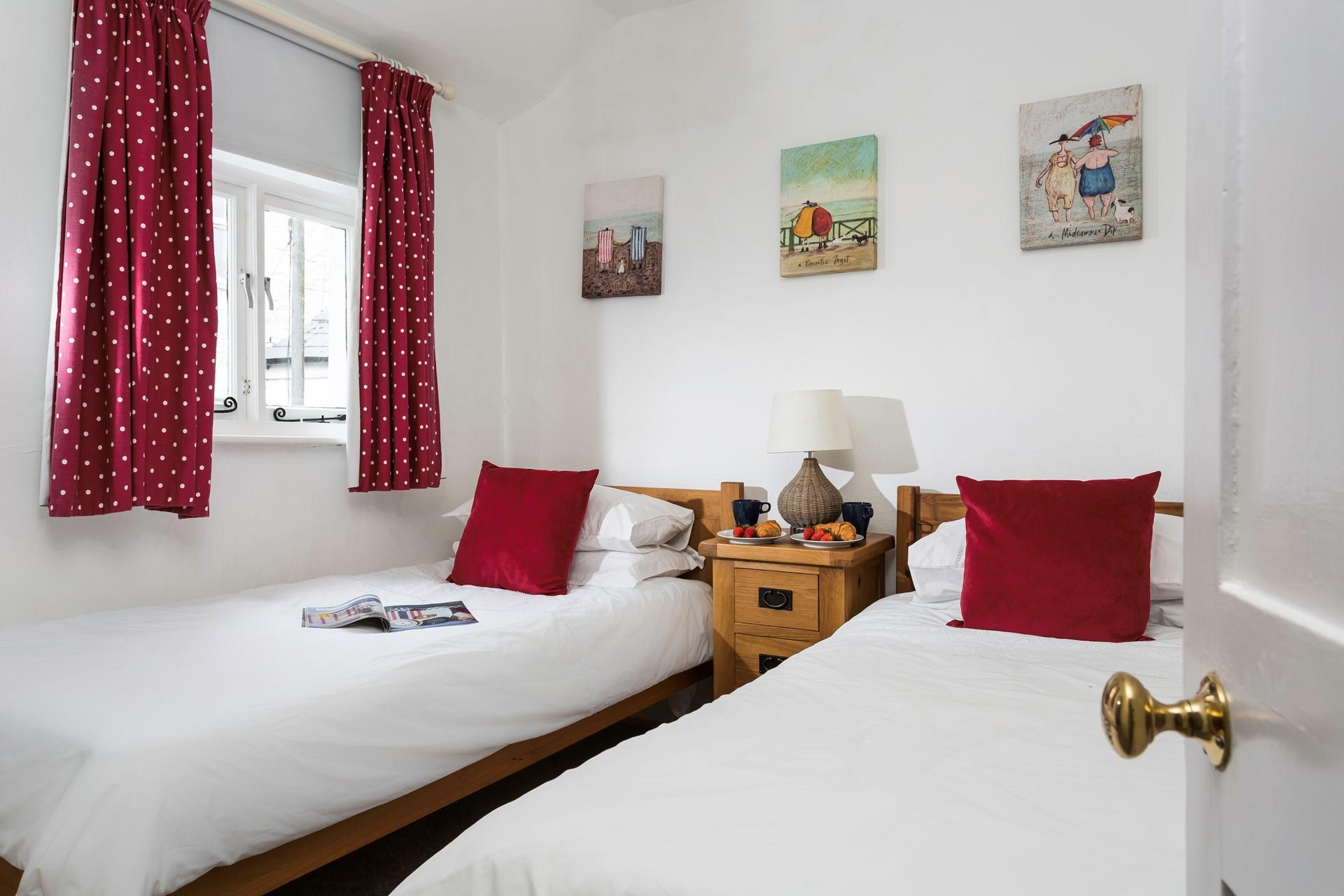 Bedroom 2 has twin beds, perfect for kids or adults.