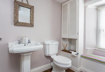 Get ready for the day in the spacious bathroom.
