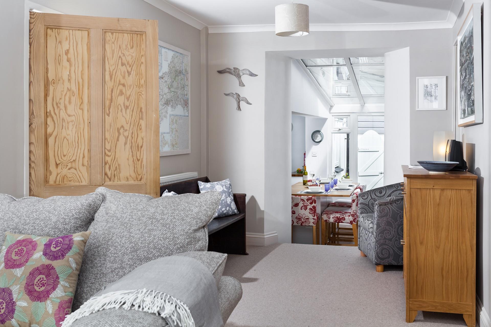 The open plan living area with steps down to the dining area and kitchen.