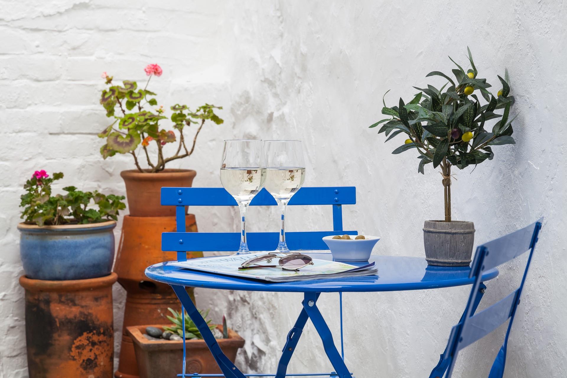 The rear yard is a sunny spot, perfect for a glass of something chilled.