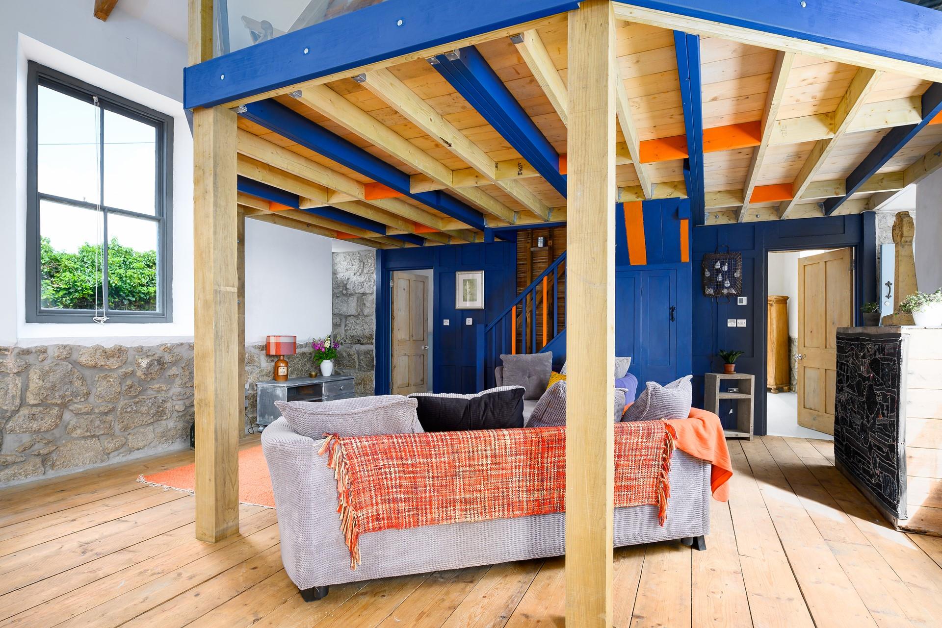 The cosy sitting area features a cuddle seat for you to curl up on.