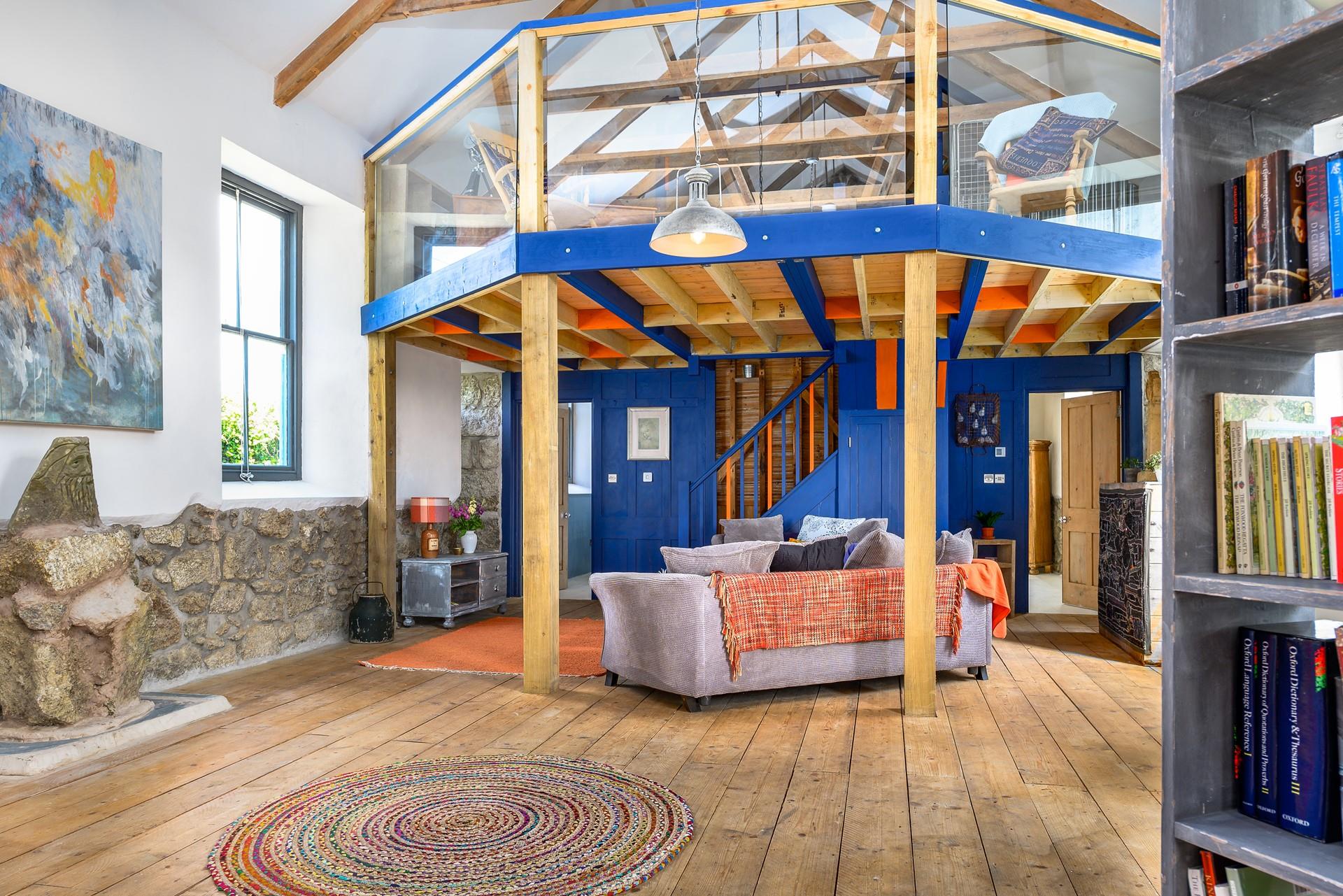 Climb the stairs to the snug in the eaves.