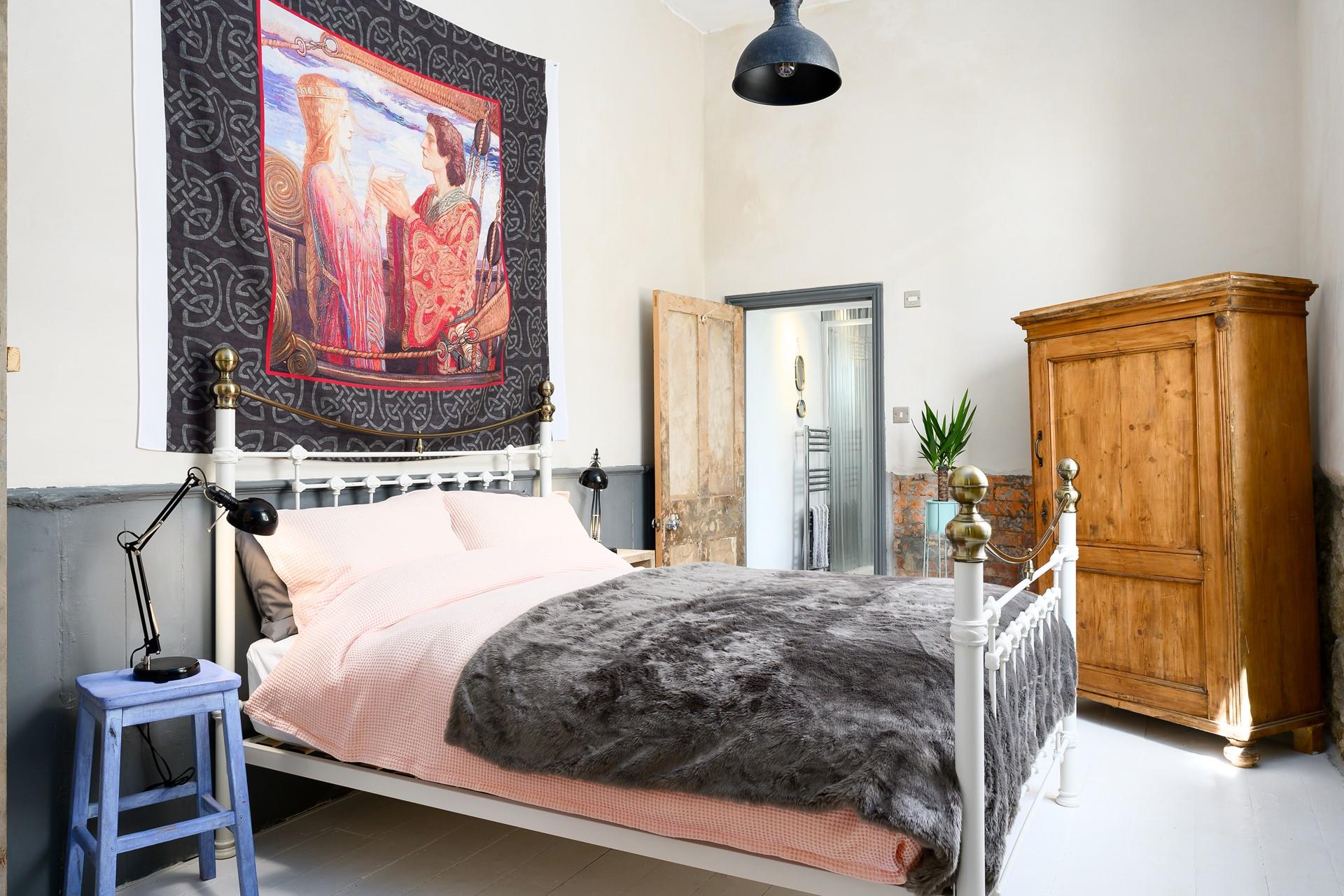 The sumptuous king size bedroom with en suite shower room at Trethewey Sunday School.