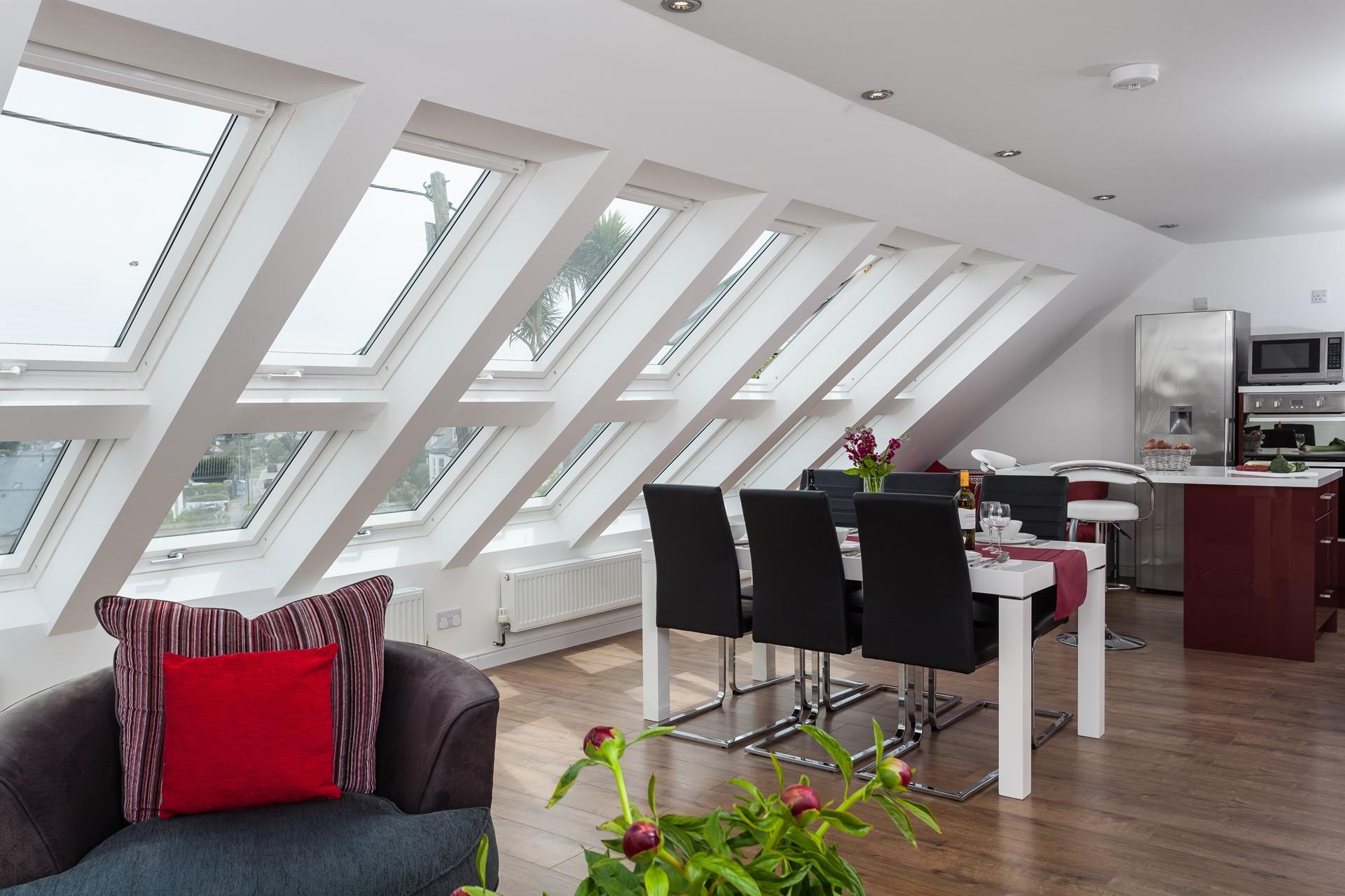 The large, stylish windows are the highlight of this incredible living area. 