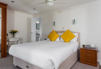 Indulge in the privacy of having an en suite in this comfortable and spacious king size bedroom. 