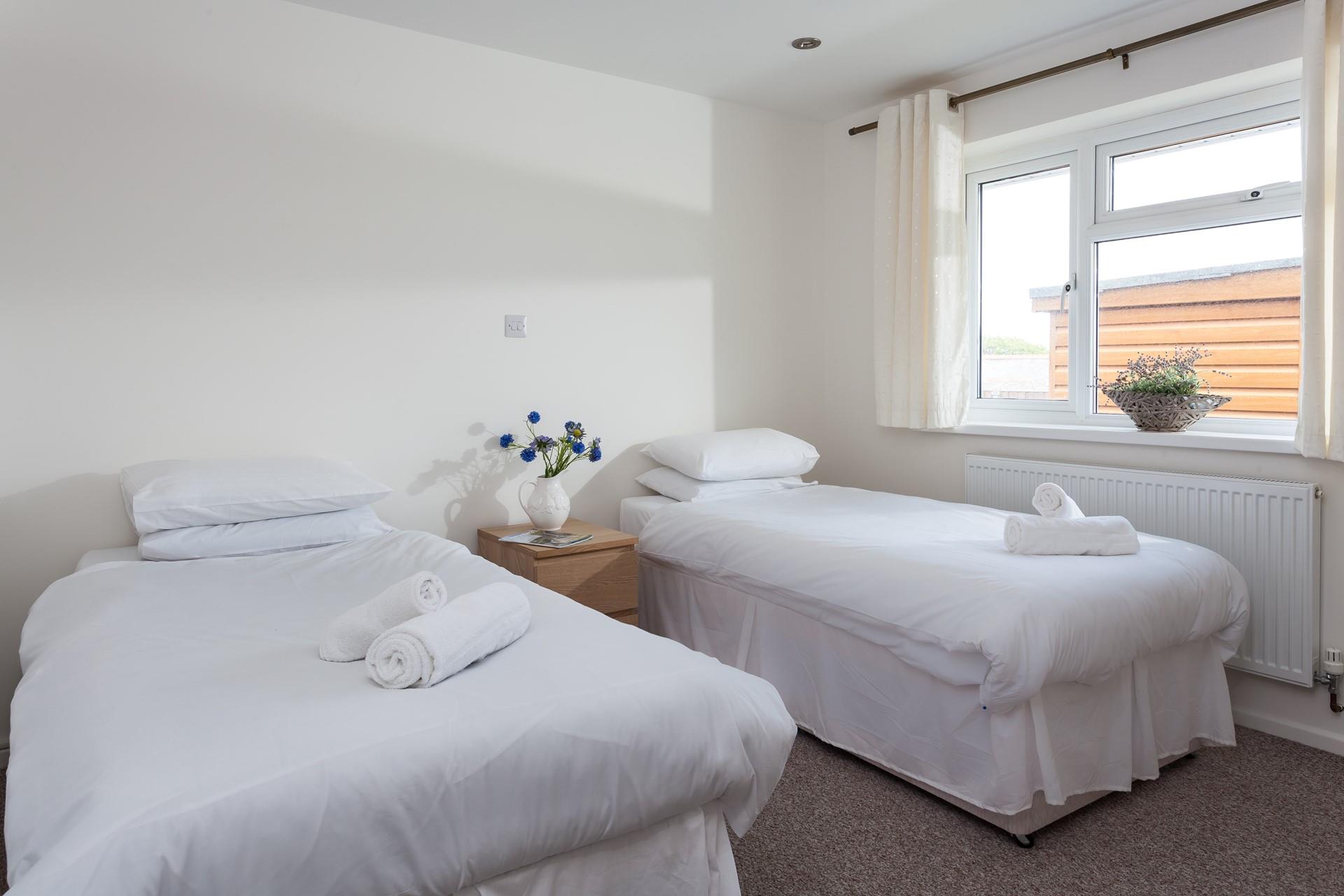 Bright and airy, bedroom 2 offers plenty of space for two adults, or children sharing. 