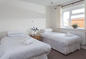 Bright and airy, bedroom 2 offers plenty of space for two adults, or children sharing. 