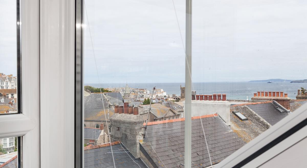 Look across the rooftops and out to sea.