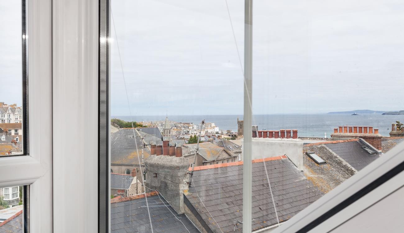 Look across the rooftops and out to sea.