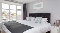 Take a seat and check out the sea glimpses from this bay window.