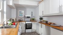 Prepare dinner for the family or friends in this well-equipped kitchen.