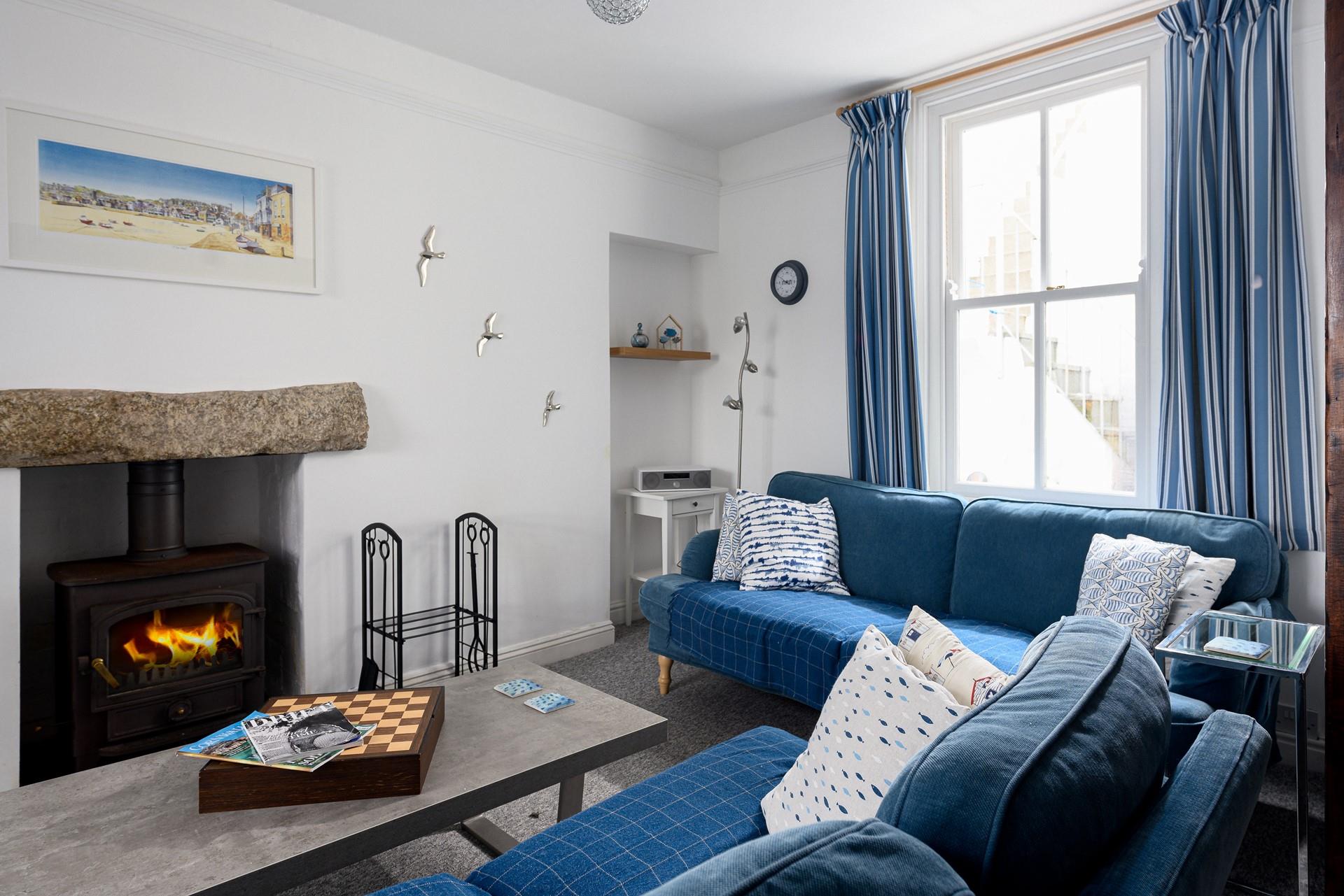 Light the wood burner and bring out the board games for a cosy afternoon in this comfortable sitting room.