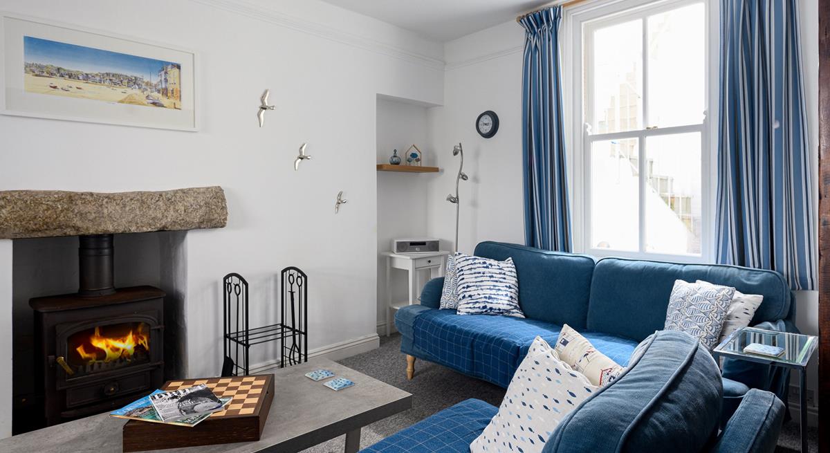 Light the wood burner and bring out the board games for a cosy afternoon in this comfortable sitting room.