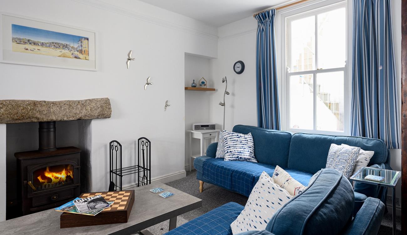 Light the wood burner and bring out the board games for a cosy afternoon in this comfortable sitting room.