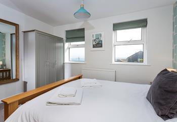 Bedroom 1 offers sea views to wake up to.