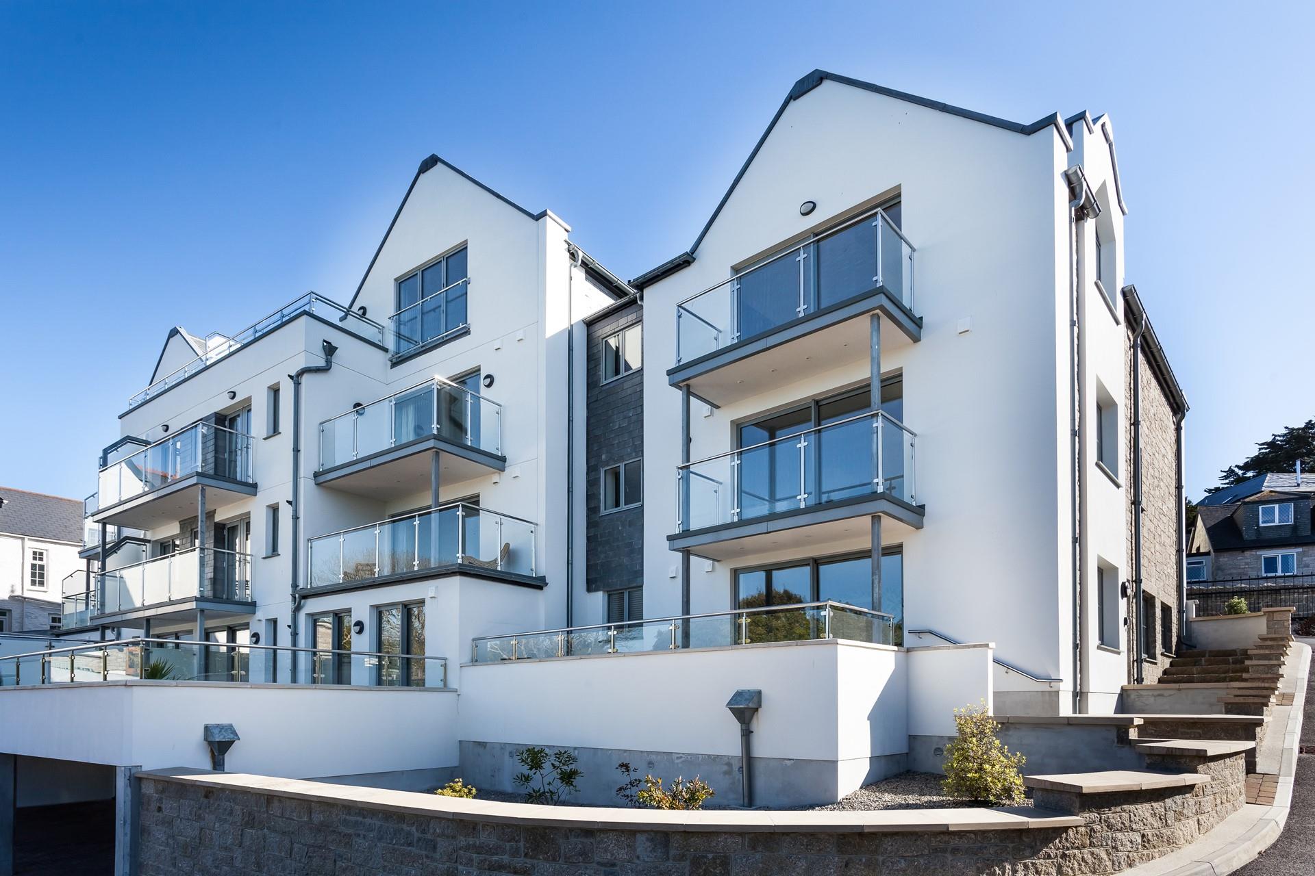 Glass balconies allow natural light to flood in.