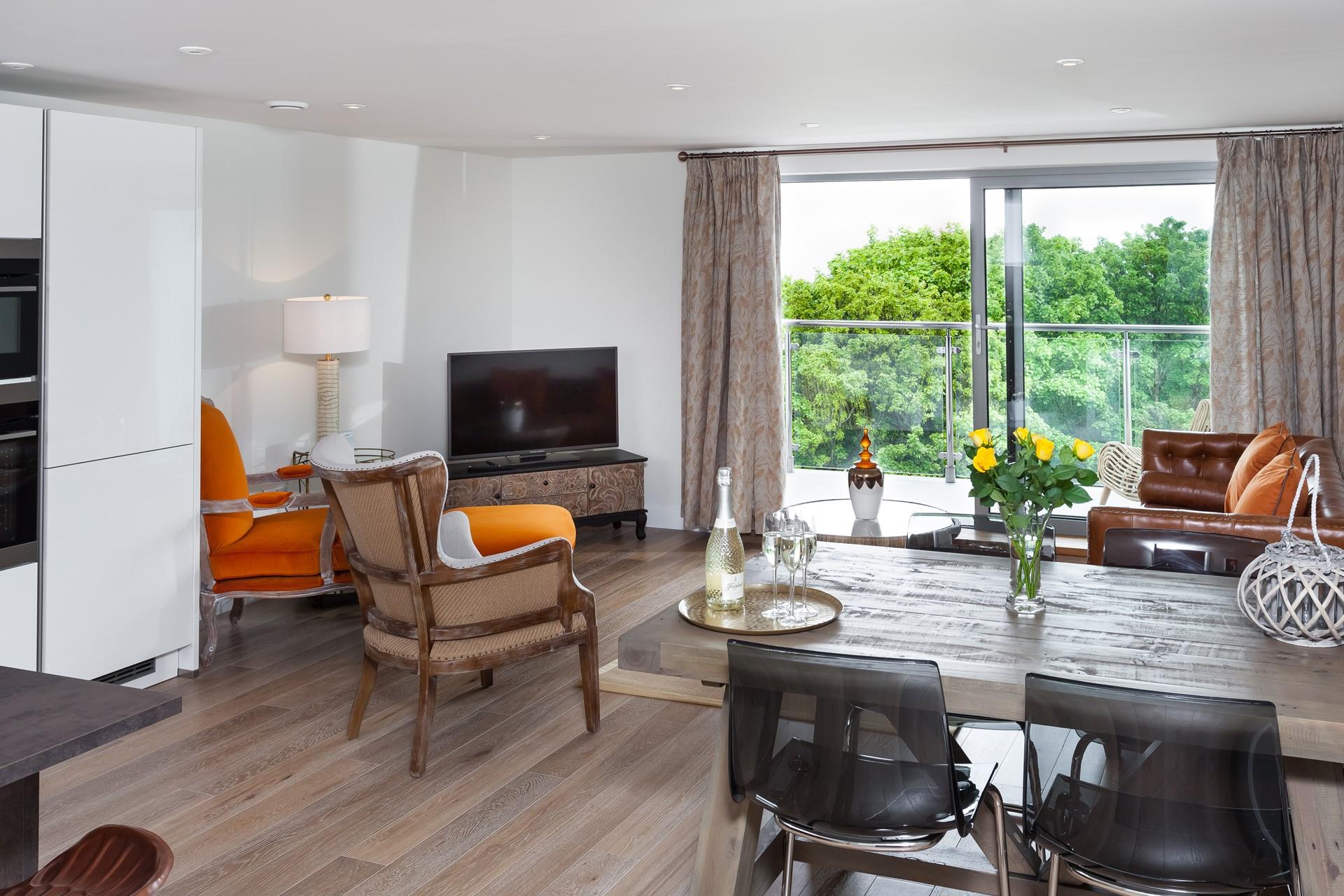 Sophisticated and contemporary furnishings give a stylish finish in this modern and open plan living space. 