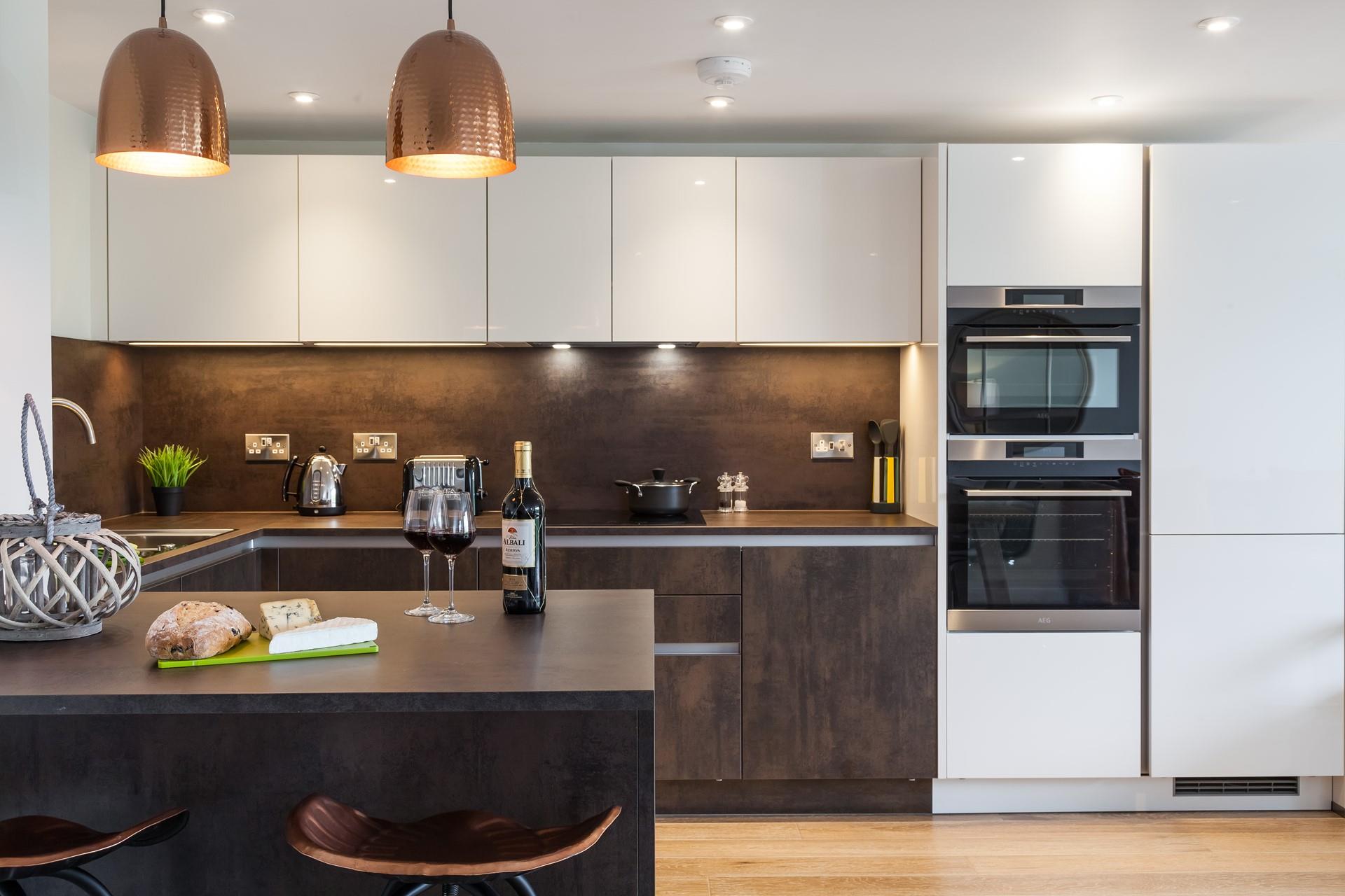 Sleek and stylish, the contemporary open plan kitchen incorporates a breakfast bar, perfect for socialising with whoever is cooking up a feast!