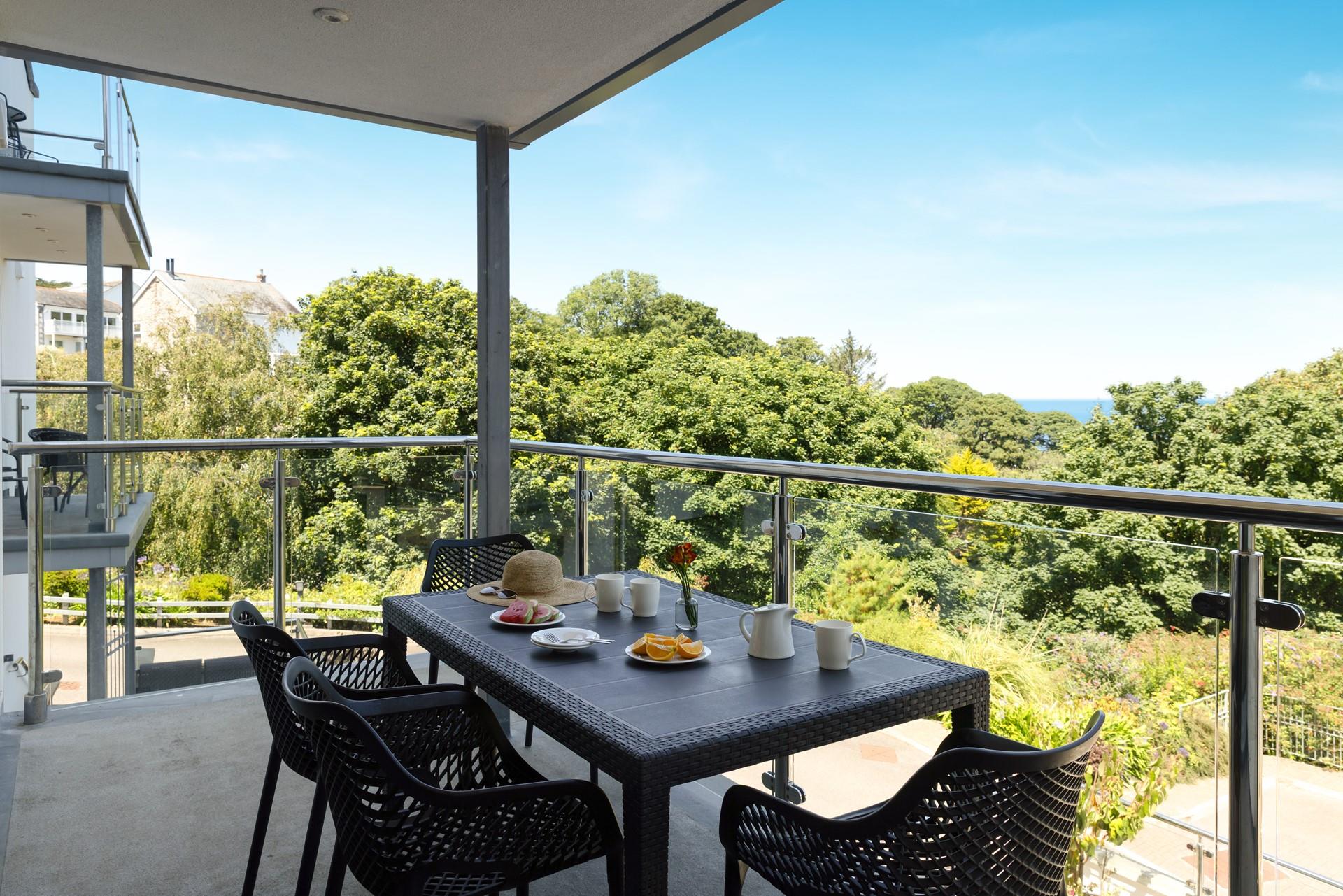 The balcony offers a wonderful space to enjoy dining alfresco. 