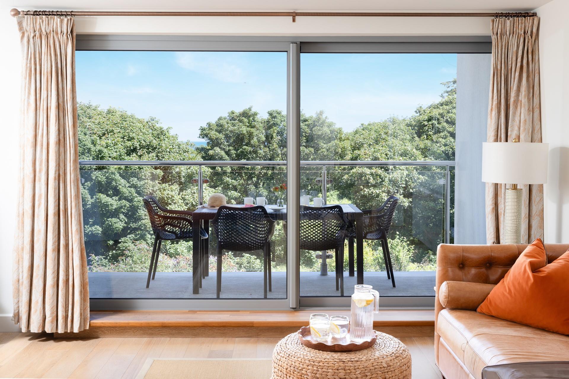 The large floor-to-ceiling windows allow you to soak up the beautiful scenery.