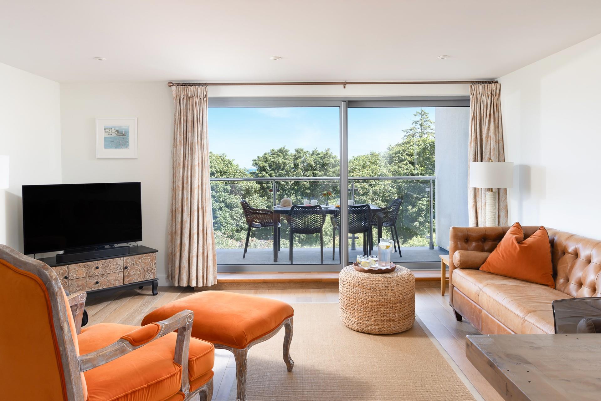 Sophisticated and contemporary furnishings give a stylish finish to this modern and open plan living space. 
