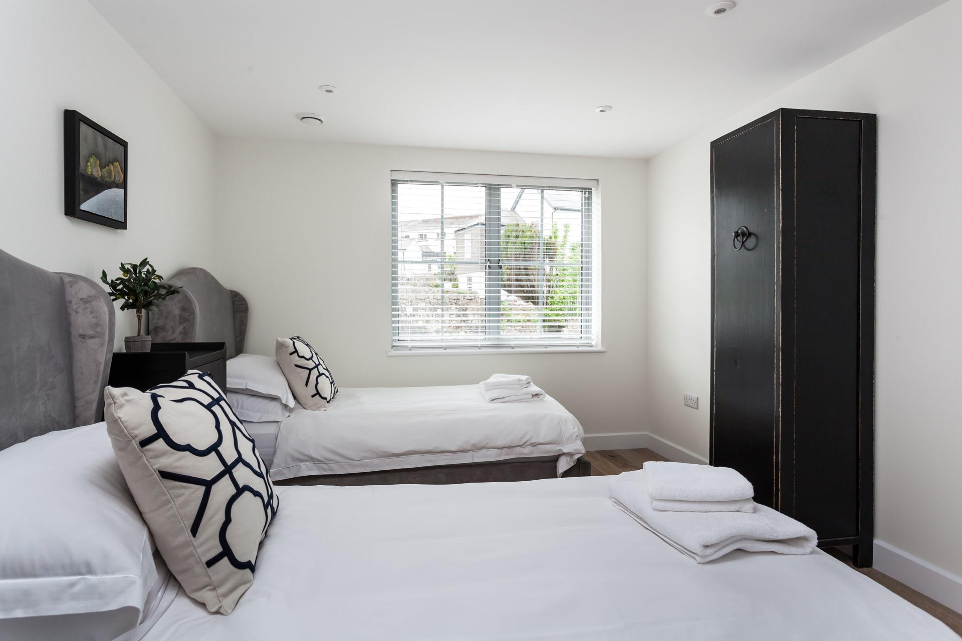 The twin beds are perfect for young adults or children to enjoy a comfortable night's sleep.