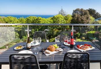 The balcony offers the perfect setting for al fresco dining.