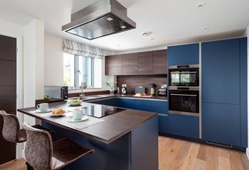 Modern and sleek, the kitchen has been beautifully finished.