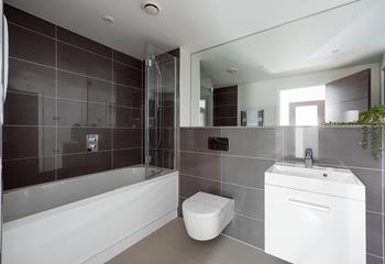 After a busy day exploring Cornwall, unwind with a soak in the stylish bathroom. 