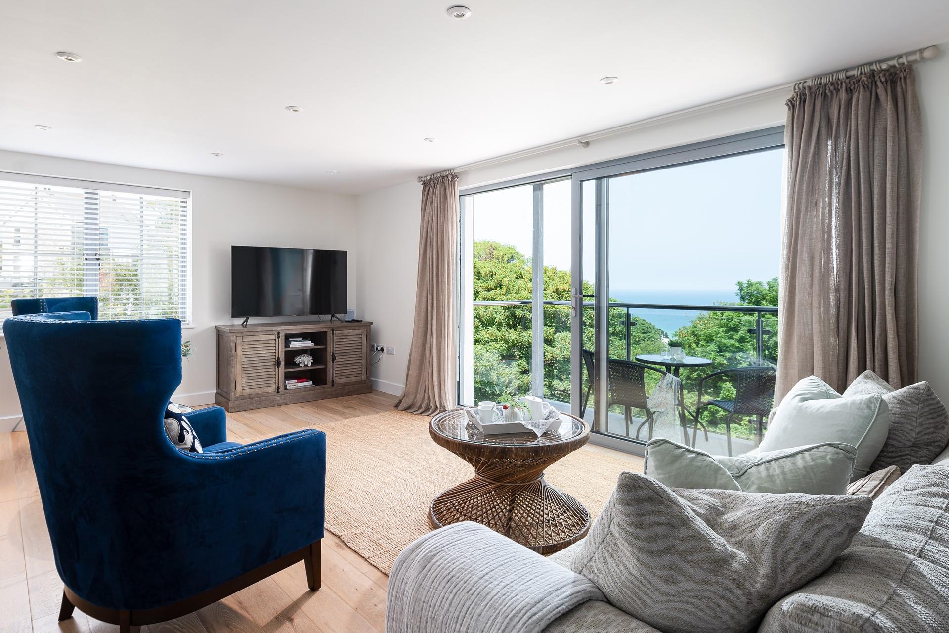 Pour a glass of bubbles, relax into one of the luxurious chairs and soak up the views through the balcony doors. 