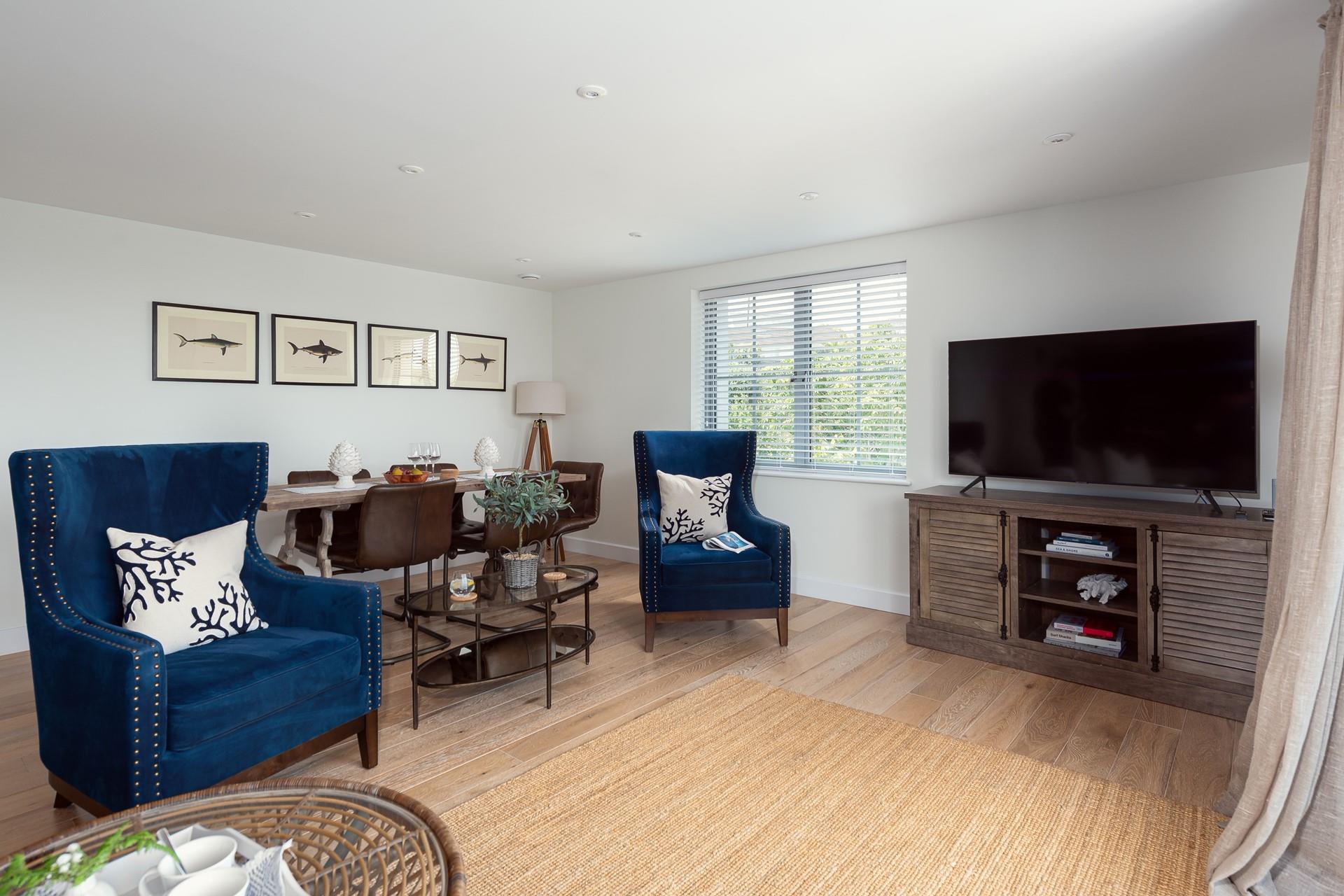 Elegantly finished, the living area is chic and stylish, perfect for unwinding on holiday. 