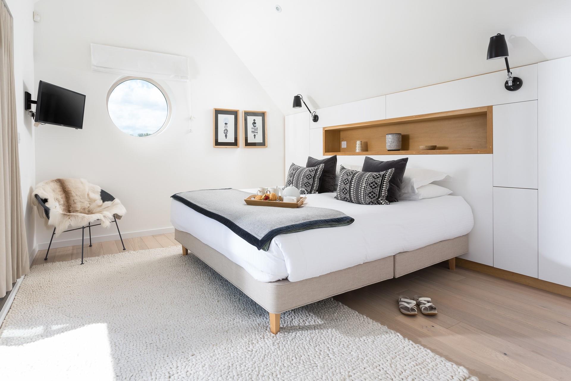 The spacious king size bed offers a blissful night's sleep.