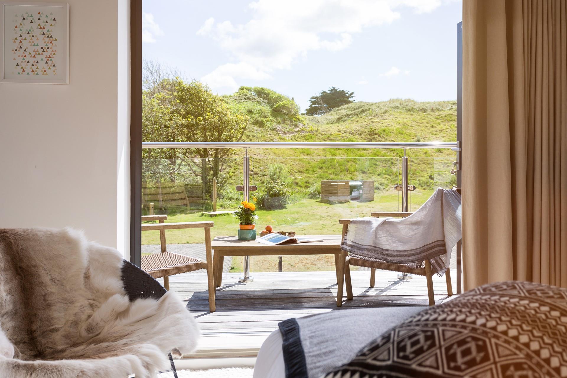 Soak up the sun on the balcony and enjoy the benefit of indoor/outdoor living in the lodge.