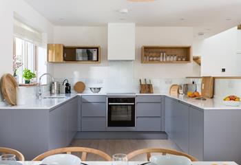 The modern well-equipped kitchen is the perfect space to cook delicious meals or pack a picnic to take to the beach.