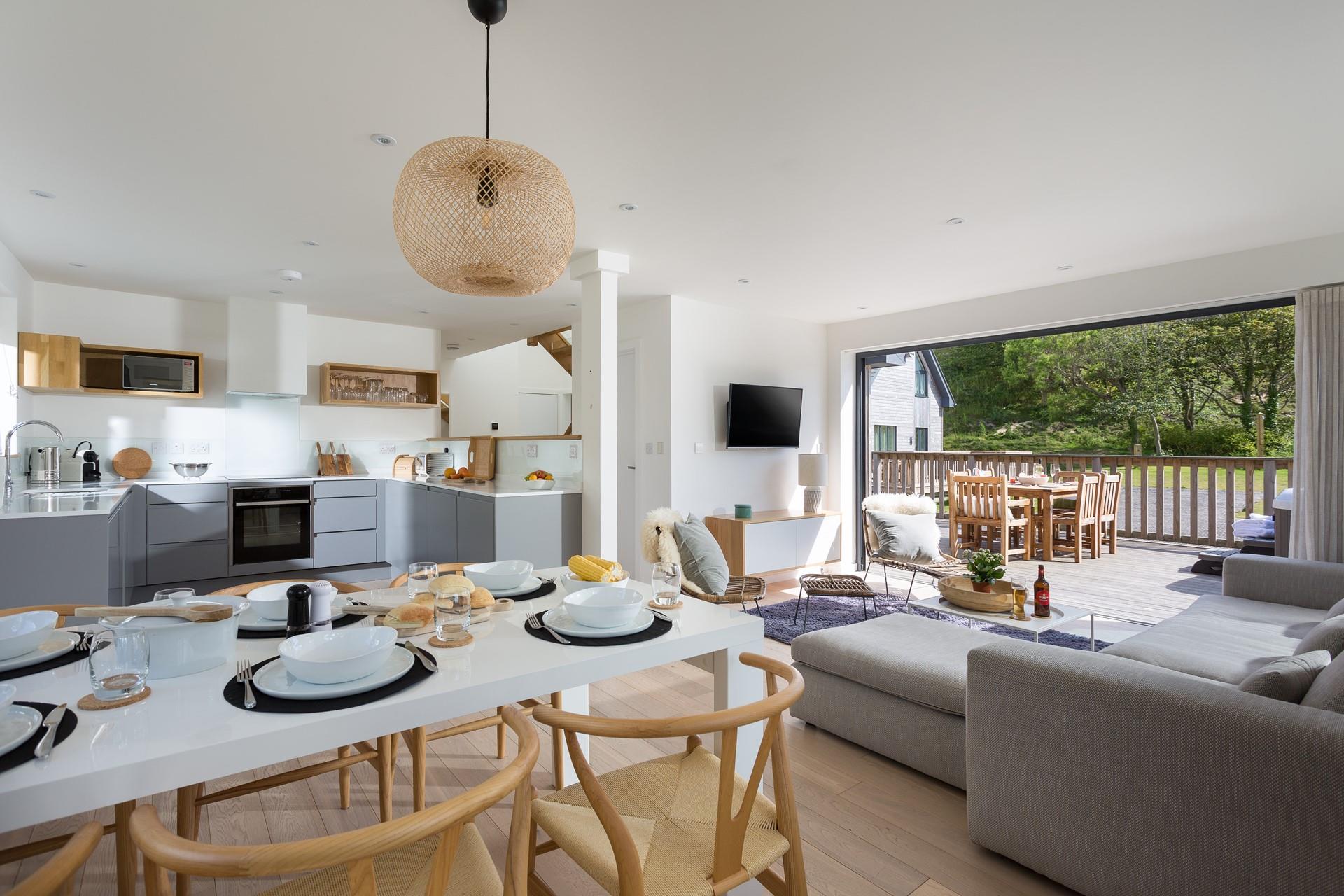 The spacious open plan living area means you can combine indoor and outdoor living on sunny days.