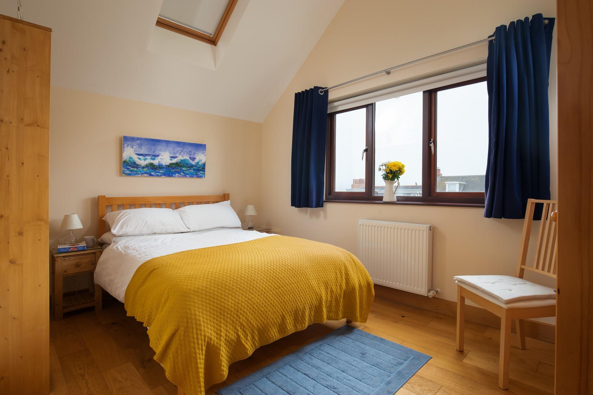 Soothing muted tones and a large comfortable bed promise a blissful night's sleep.